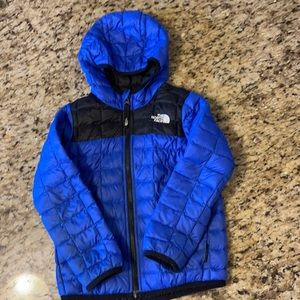 Blue and Black North Face light weight winter coat